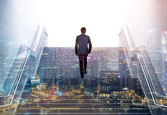 Man walking up staircase in modern metropolis city with skyscrapers, symbolizing progress and ambition.